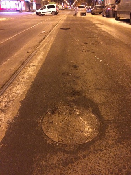 На улице Смолячкова 16, возле метро Выборгская, лежит на дороге обломанная крышка люка , сам люк за...